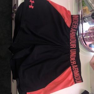 pink and black under armor running shorts